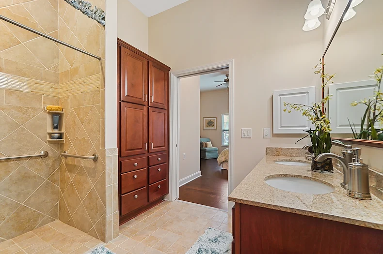 Brightmore of South Charlotte senior living community offering independent living, assisted living, and memory care in Charlotte, NC, apartment bathroom with tiled walk in shower