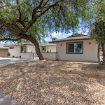 Legato Living Residential Memory Care at Old Town senior living community offering assisted living and memory care in Scottsdale, AZ, front exterior with large trees in view