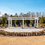 Westhill Macon senior living community offering assisted living and memory care in Macon, GA, outdoor sitting area under a pergola