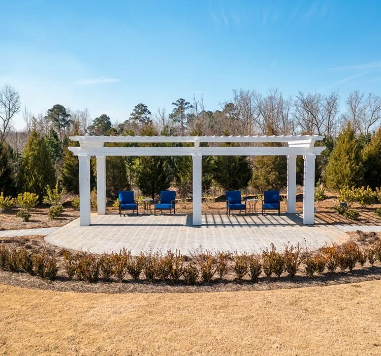 Westhill Macon senior living community offering assisted living and memory care in Macon, GA, outdoor sitting area under a pergola