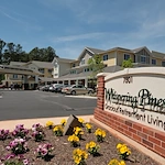 Whispering Pines Gracious Retirement Living Hawthorn Senior Independent Living in Raleigh, North Carolina front exterior welcome sign