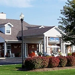 Rosegate Assisted Senior Living and Garden Homes in Indianapolis, IN front exterior entrance with welcome home sign
