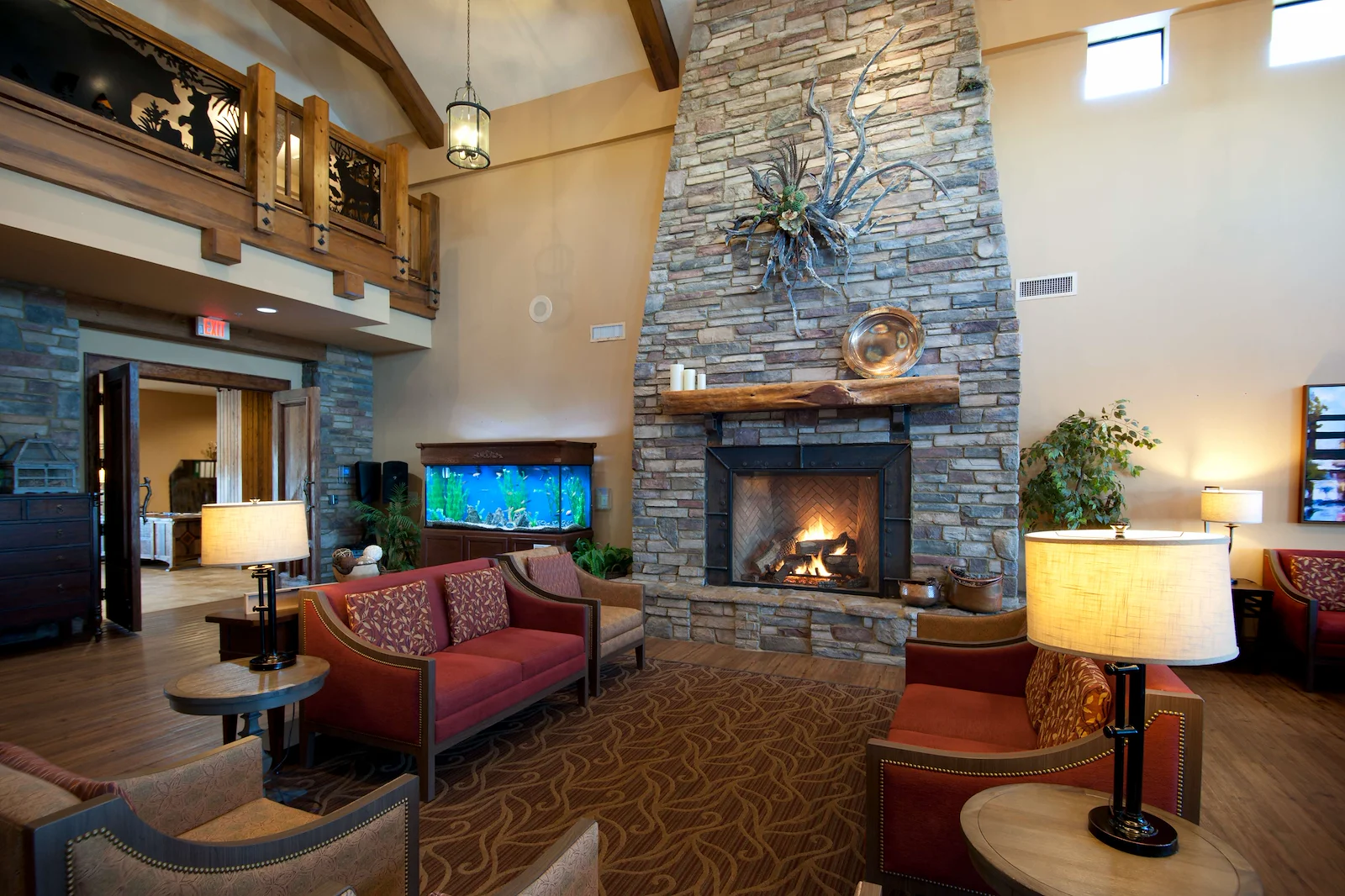 Alto Tavares, senior living community offering assisted living, memory care, and respite care in Tavares, FL, comfortable sitting area by a fireplace