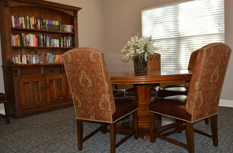 Rosegate Assisted Senior Living and Garden Homes in Indianapolis, IN library with bookshelf