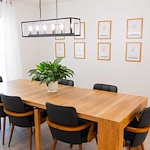 Legato Living Residential Memory Care at Heartland Hills senior living community offering assisted living, memory care, adult day services, and respite care in Bellevue, NE, dining room with a large wooden table