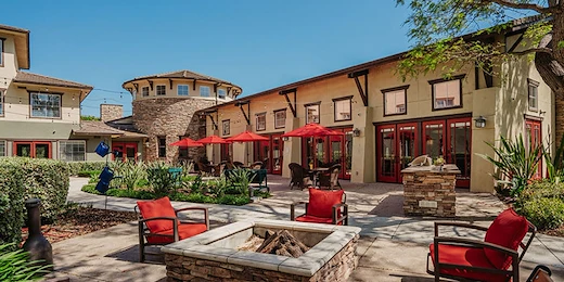 Woodbridge Terrace of Irvine, independent living, assisted living, and memory care in Irvine, CA, exterior with seating area