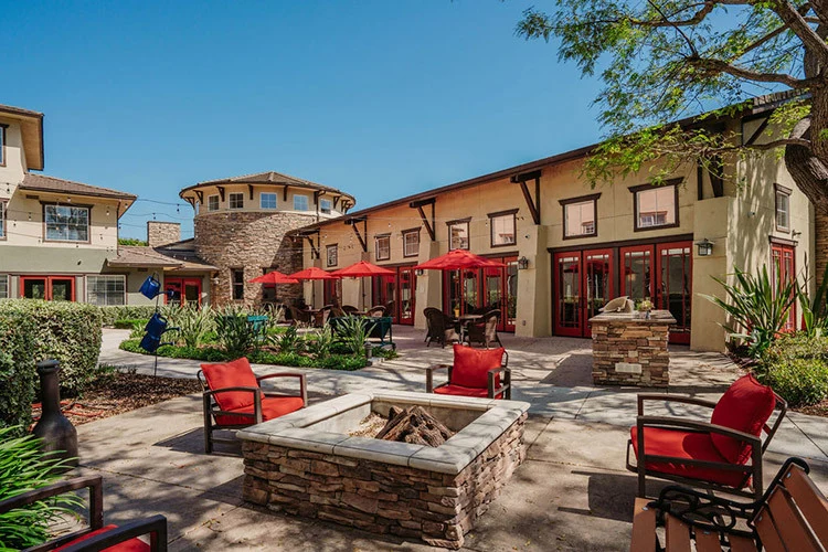 Woodbridge Terrace of Irvine, independent living, assisted living, and memory care in Irvine, CA, exterior with seating area