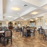 Assisted living and memory care at Belleview Heights Senior Living in Aurora, CO, community room with tables for dining or activities