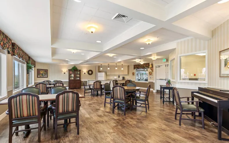 Assisted living and memory care at Belleview Heights Senior Living in Aurora, CO, community room with tables for dining or activities