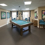 Alto Tavares, senior living community offering assisted living, memory care, and respite care in Tavares, FL, activities room with a pool table