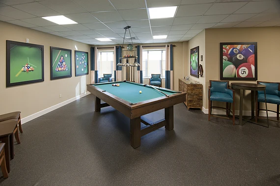 Alto Tavares, senior living community offering assisted living, memory care, and respite care in Tavares, FL, activities room with a pool table