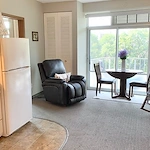 Plymouth Place independent living apartment kitchen and living room
