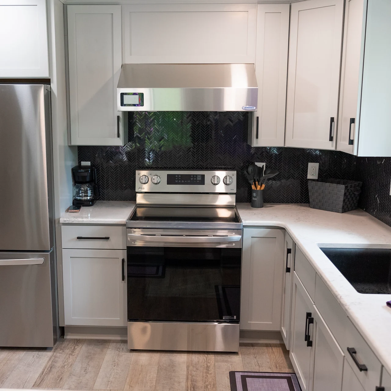 Legato Living Residential Memory Care at Heartland Hills senior living community offering assisted living, memory care, adult day services, and respite care in Bellevue, NE, kitchen with white cabinets, white countertops, and stainless steel appliances