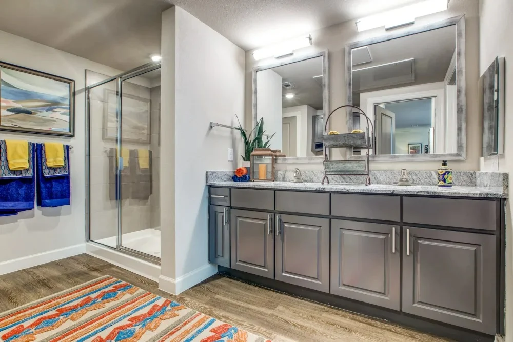 Watermere at Round Rock senior living community offering active adult living and independent living in Round Rock, TX, apartment bathroom with a double vanity