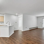 Sage Independence, Independent Living in Des Moines, IA newly renovated unfurnished apartment kitchen and living room