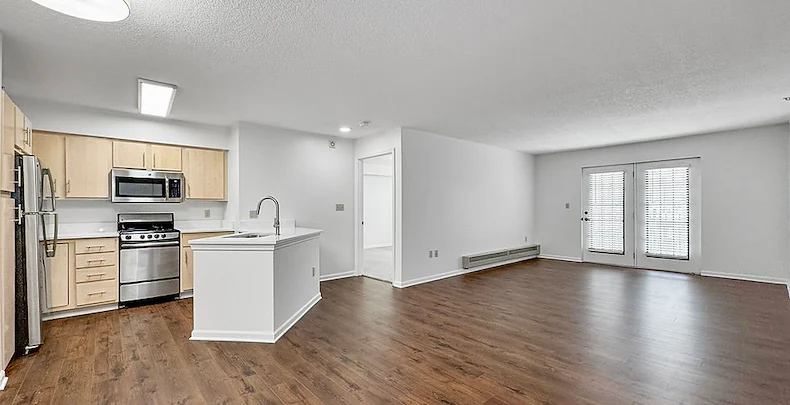 Sage Independence, Independent Living in Des Moines, IA newly renovated unfurnished apartment kitchen and living room