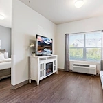 Avamere at Mountain Ridge senior living community offering assisted living, memory care, and respite care in South Ogden, UT, apartment featuring a living room and bedroom