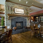 Covenant Living at Inverness in Tulsa, OK, visiting area by fireplace