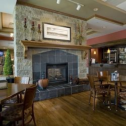 Covenant Living at Inverness in Tulsa, OK, visiting area by fireplace