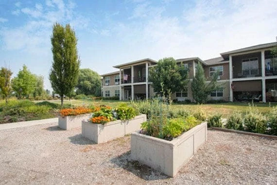 Wenatchee Senior Living by Cogir senior living community offering independent living, assisted living, and respite care in Wenatchee, WA, outdoor area with garden beds