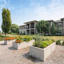 Wenatchee Senior Living by Cogir senior living community offering independent living, assisted living, and respite care in Wenatchee, WA, outdoor area with garden beds