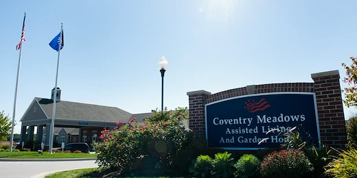 Coventry Meadows Senior Living in Fort Wayne, IN front exterior entrance sign that reads "Coventry Meadows Assisted Living And Garden Homes"