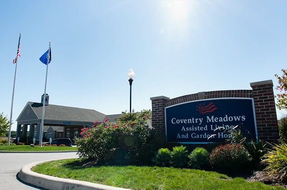 Coventry Meadows Senior Living in Fort Wayne, IN front exterior entrance sign that reads "Coventry Meadows Assisted Living And Garden Homes"