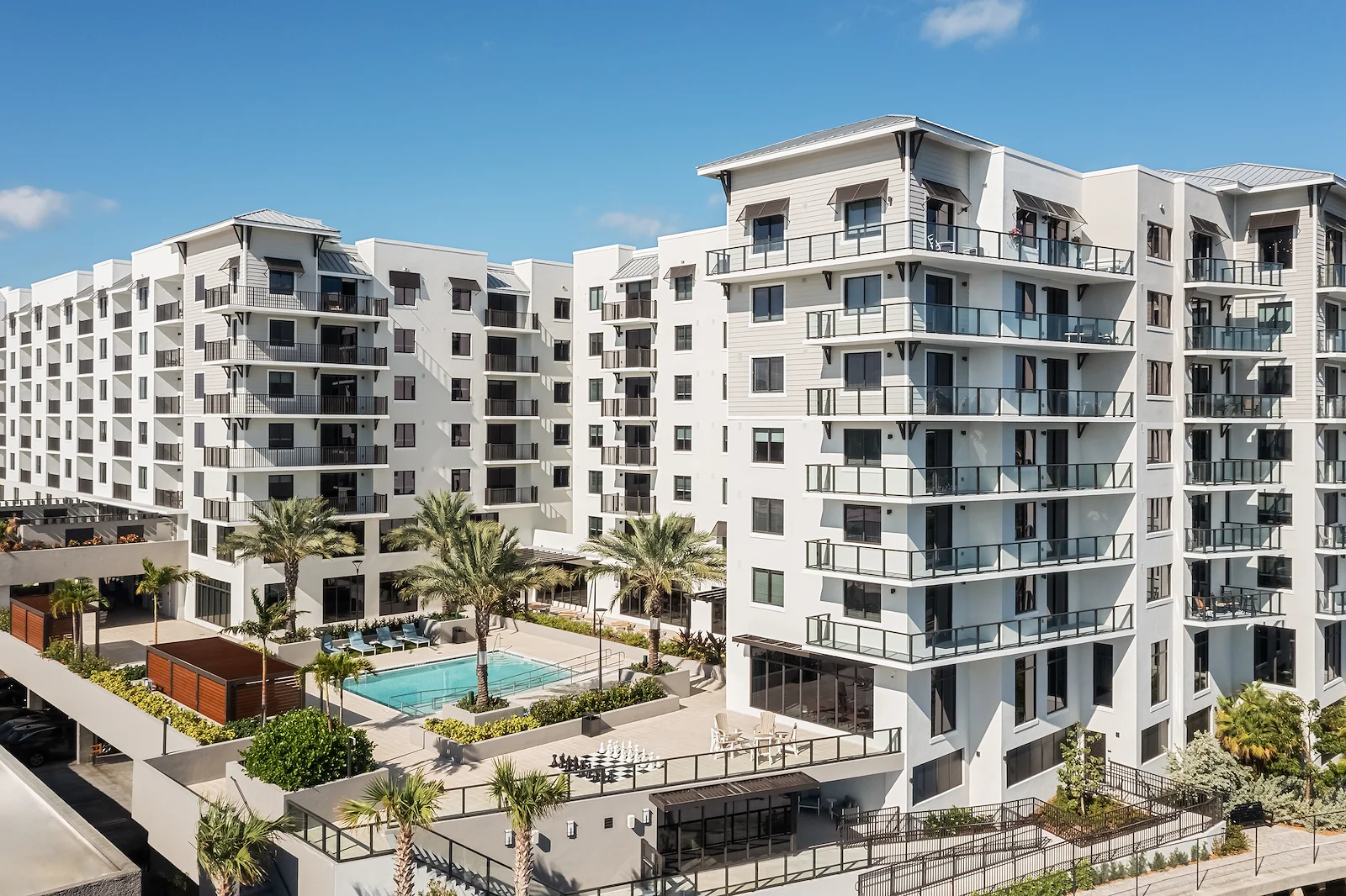 Allegro Fort Lauderdale, senior living community in Fort Lauderdale, FL, offering independent living, assisted living, memory care, and respite care, exterior featuring a community pool and balconies