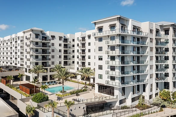 Allegro Fort Lauderdale, senior living community in Fort Lauderdale, FL, offering independent living, assisted living, memory care, and respite care, exterior featuring a community pool and balconies
