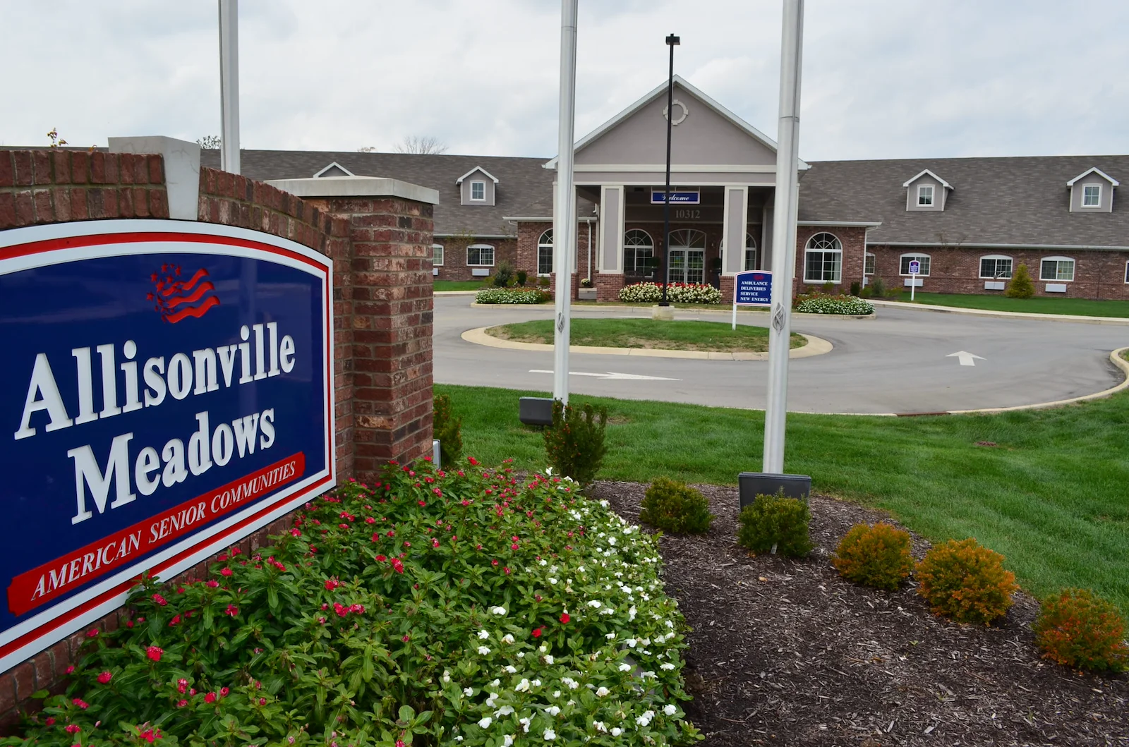 Allisonville Meadows Assisted Living offering assisted living, memory care, and respite care in Fishers, IN, front exterior driveway and entrance sign