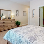 Bedroom in an apartment at Gaines Park Senior Living