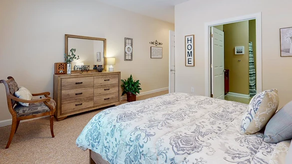 Bedroom in an apartment at Gaines Park Senior Living