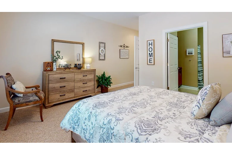 Bedroom in an apartment at Gaines Park Senior Living
