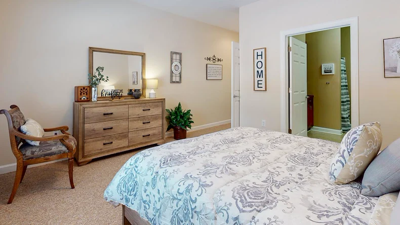 Bedroom in an apartment at Gaines Park Senior Living