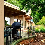 Legato Living Residential Memory Care at Eastridge senior living community offering assisted living, memory care, adult day services, and respite care in Omaha, NE, back patio with seating and a grill