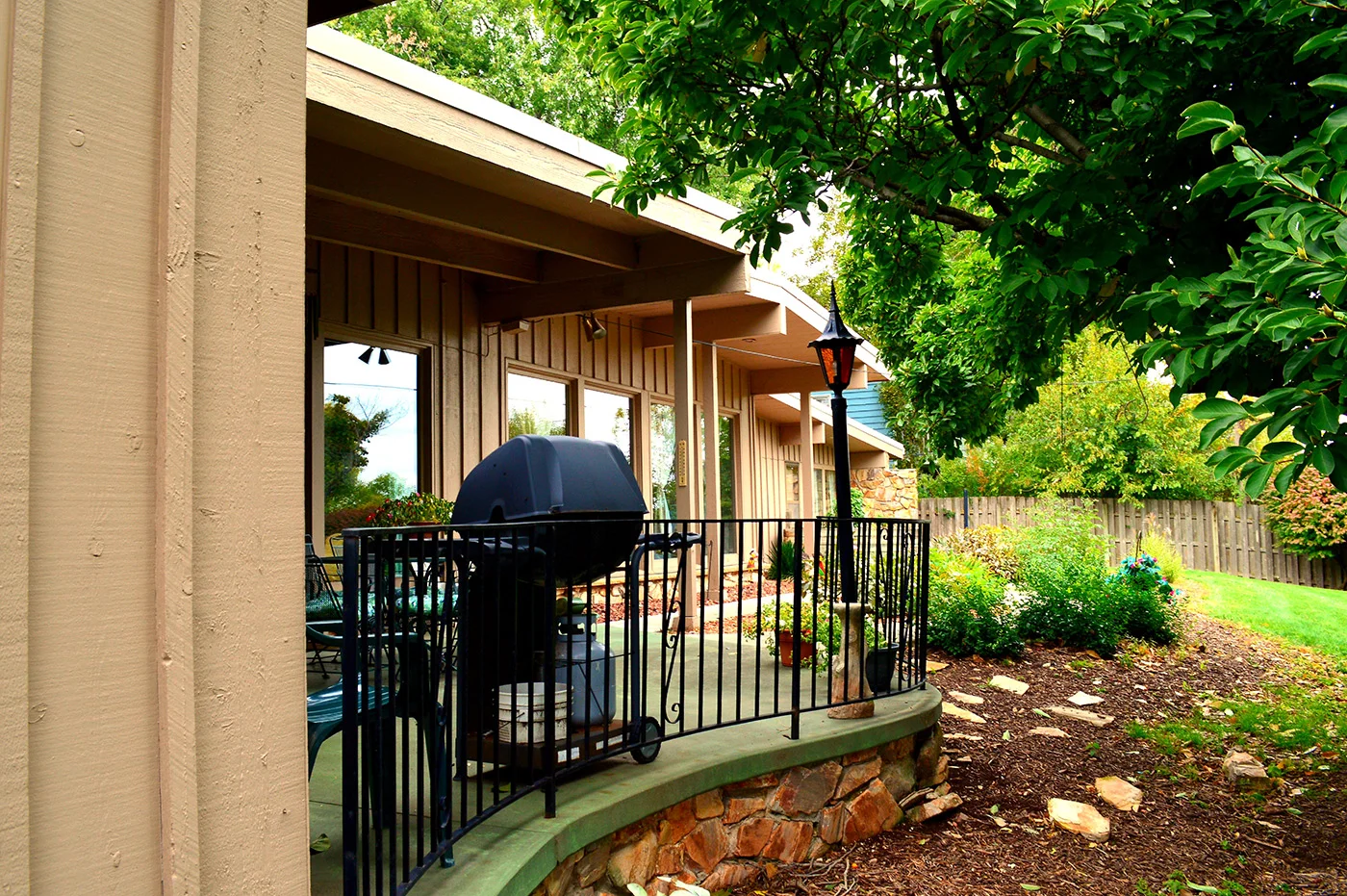 Legato Living Residential Memory Care at Eastridge senior living community offering assisted living, memory care, adult day services, and respite care in Omaha, NE, back patio with seating and a grill