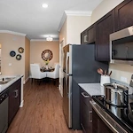 Kitchen and dining area in one of Verena at Gilbert's Senior Living apartments