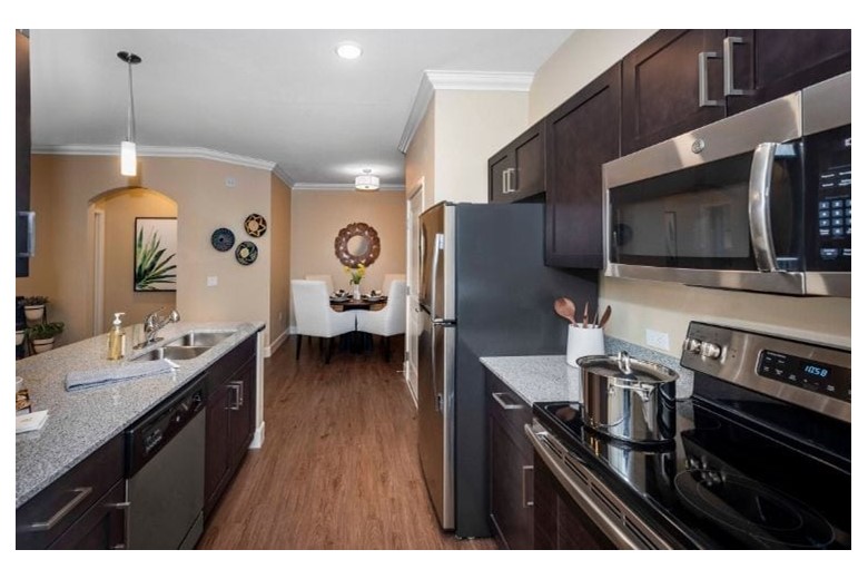Kitchen and dining area in one of Verena at Gilbert's Senior Living apartments