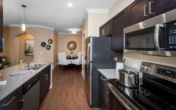 Kitchen and dining area in one of Verena at Gilbert's Senior Living apartments