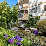Sit by the fountain in the lush grounds of the Cristwood Park courtyard 