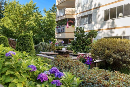 Sit by the fountain in the lush grounds of the Cristwood Park courtyard 