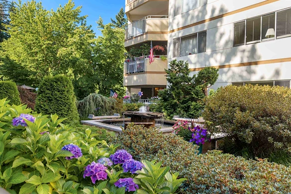 Sit by the fountain in the lush grounds of the Cristwood Park courtyard 