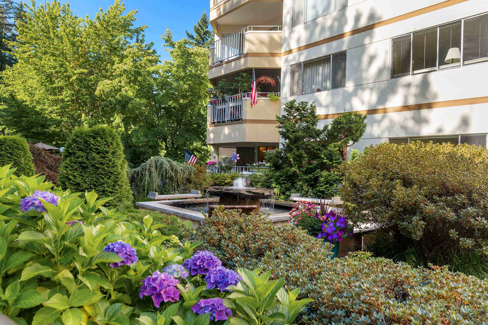 Sit by the fountain in the lush grounds of the Cristwood Park courtyard 