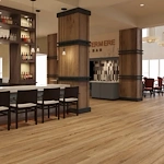 Watermere at Flower Mound senior living community offering active adult living and independent living in Flower Mound, TX, bar area with countertop and bar stool seating, with a view into the dining room