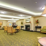 Pomeroy Living Sterling Senior Living common sitting area by fireplace