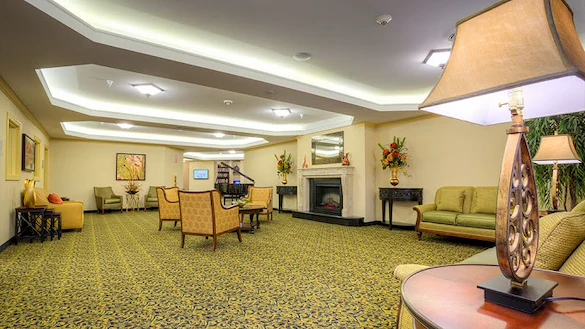Pomeroy Living Sterling Senior Living common sitting area by fireplace