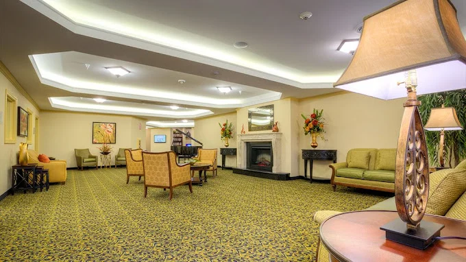 Pomeroy Living Sterling Senior Living common sitting area by fireplace