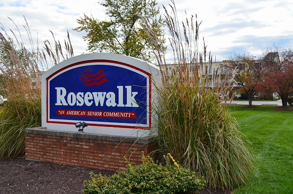 Rosewalk at Lutherwoods Assisted Senior Living in Indianapolis, IN front exterior welcome sign that says "Rosewalk 'An American Senior Community'"
