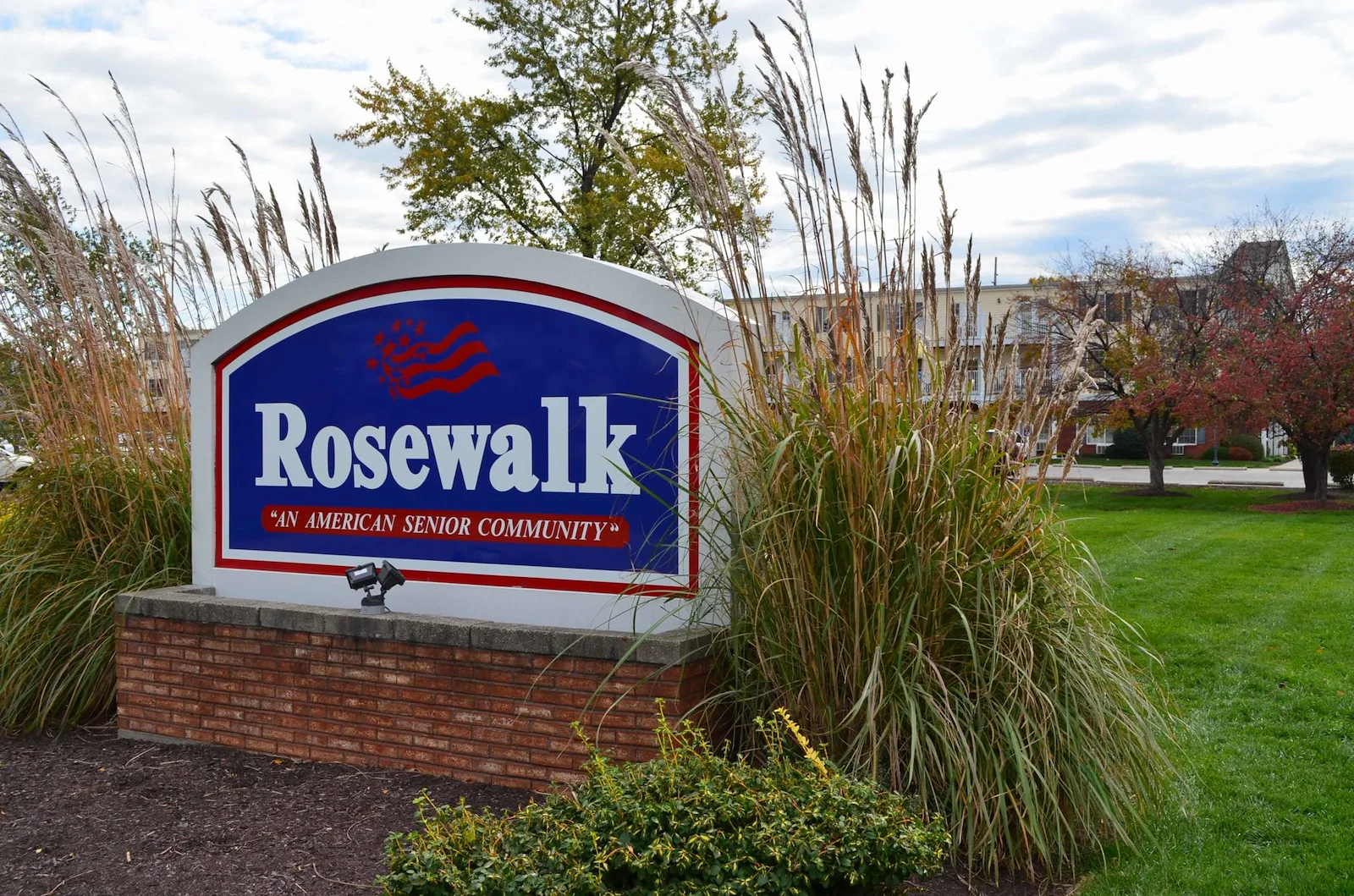 Rosewalk at Lutherwoods Assisted Senior Living in Indianapolis, IN front exterior welcome sign that says "Rosewalk 'An American Senior Community'"