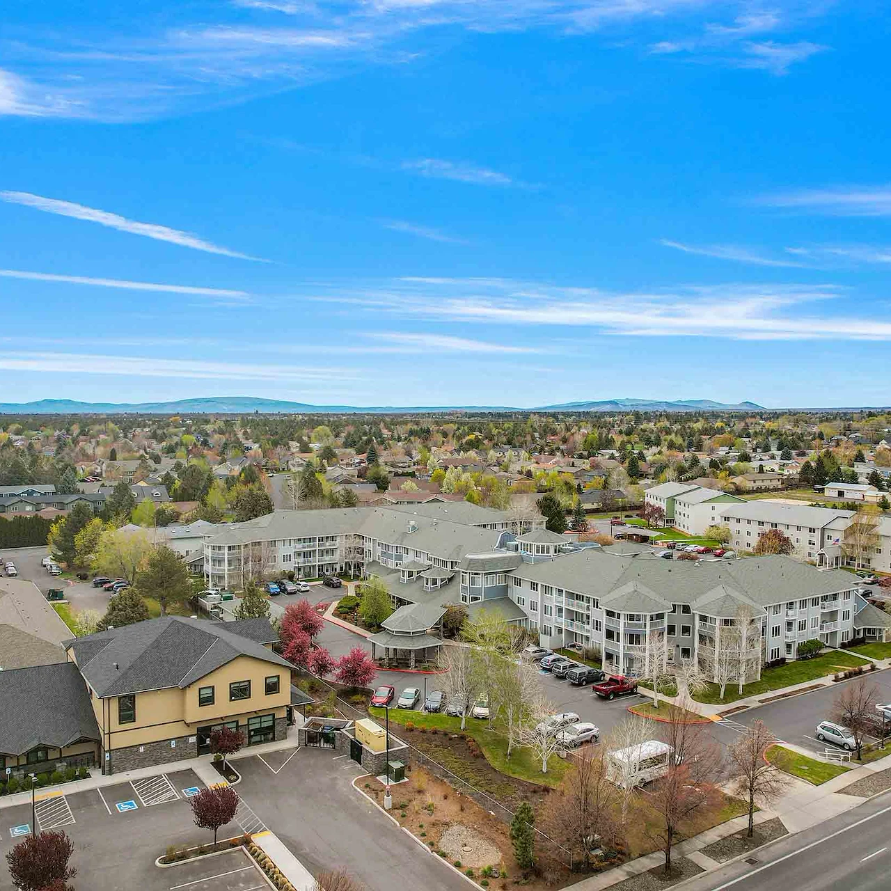 Stone Lodge Gracious Retirement Living Hawthorn Senior independent Living in Bend, Oregon front exterior drone view